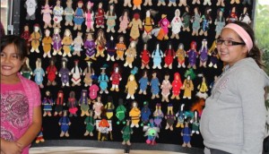 Karissa and Nicole Hewson were pleased to add their faceless dolls to the display at Sault College during the Sisters in Spirit event.   – Photo by Margaret Hele
