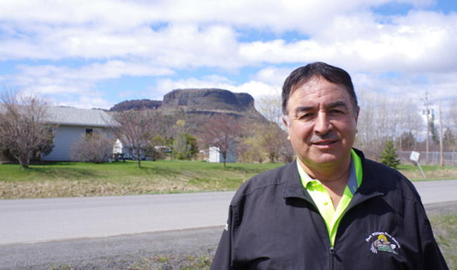 Fort William Chief Peter Collins stands outside the band office with Animikii-waajiw (Mt. McKay) in the background. He says it is important for residents and visitors to recognize the Indigenous territories and communities they are in.