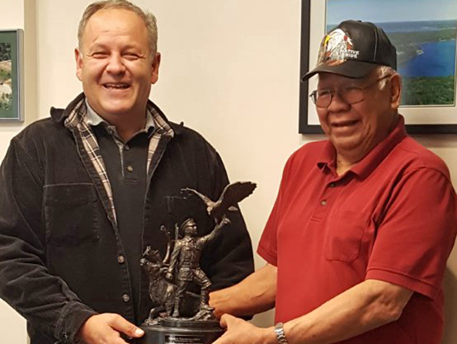 Chief Warren Tabobondung (Wasauksing First Nation) and Chief Wayne Pamajewon (Shawanaga First Nation), with model of the bronze to be unveiled on June 21st. 
