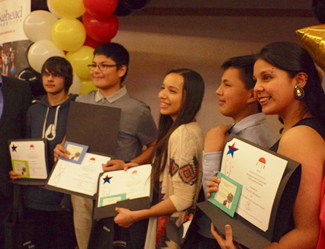 Pays Plat's Travis Jordan, far left  and Biinjitiwaabik Zaaging Anishinaabek's Winonah Thompson, far right, were among six recipients of the Sandra Kakeeway Cultural Award at the 12th Annual Northwestern Ontario Aboriginal Youth Achievement and Recognition Awards on May 5.