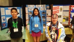 Eli Paibomsai, Avery Sutherland, and Shade Kaiser, with their projects at the Provincial Heritage Fair, Toronto, June 11