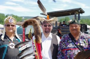 Grand Council Chief Patrick Madahbee, Pays Plat Chief Xavier Thompson and Pays Plat Councillor Raymond Goodchild participated in the Pays Plat First Nation Pow Wow Grand Entry on July 23 during Madahbee's visit to the Northern Superior Region community.