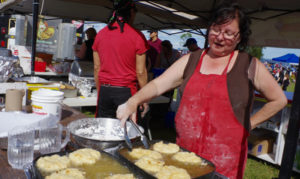Pays Plat’s Jeanette Posine, known as the bannock lady, fries up another batch of fry bread at her booth at the Canada Day celebrations in Thunder Bay.