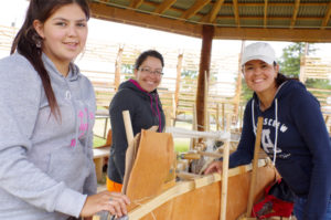 Fort William youth Shaylah Fenton, Miranda Fenton and Tanya Fenton helped build an 18-foot birch bark canoe this summer on Mt. McKay. A group of Fort William youth previously built a smaller canoe last summer.